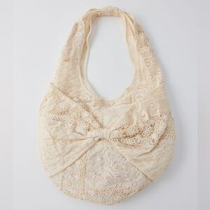UO x Kimchi Blue Lace Bow Slouchy Bag